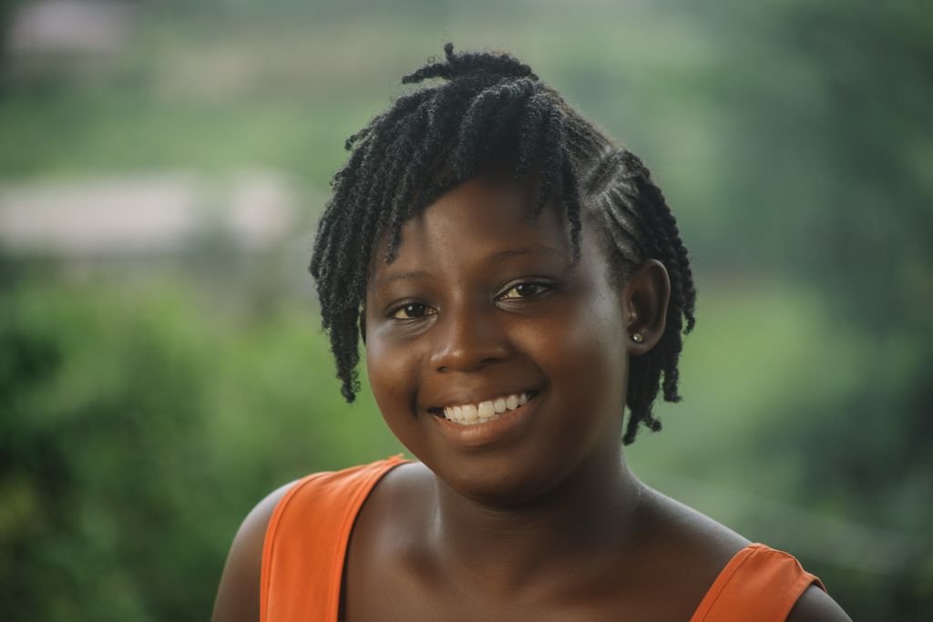 Chin-length braided bob with inward-curved ends framing the face