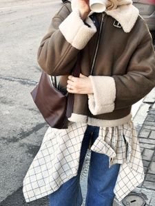Korean winter outfit ideas layered look with a shearling jacket and statement coat