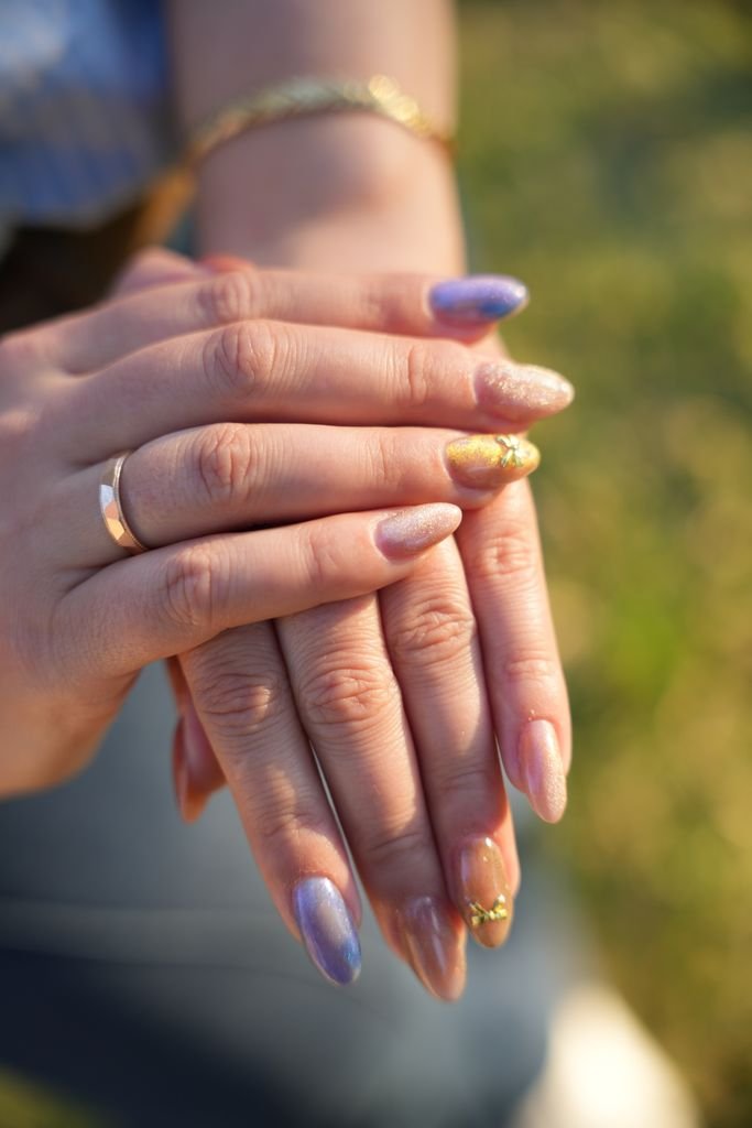 Mismatched French tips with a different pastel color on each nail