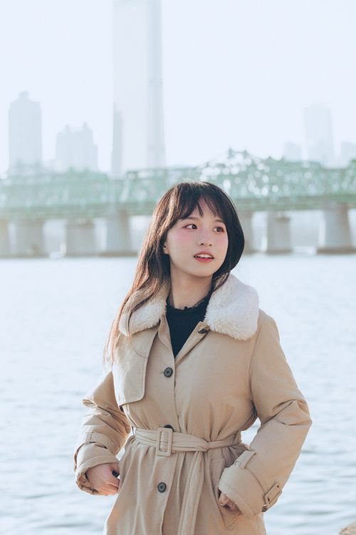 Beige belted winter coat with shearling collar - elegant Korean winter outfit idea