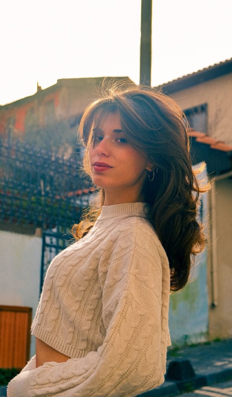 Long layered haircut with face-framing layers and bouncy blowout movement