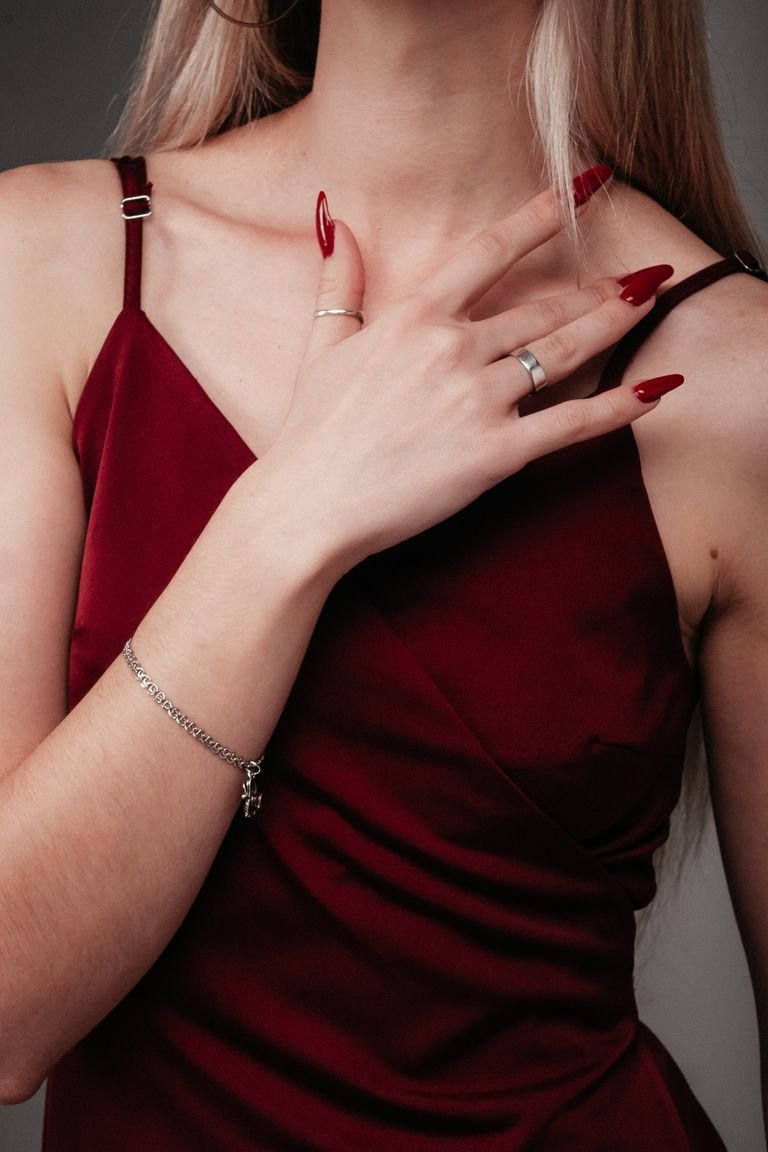 Winter nail designs in deep burgundy with a glossy festive finish